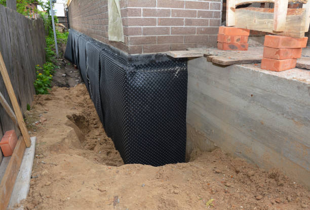Happy homeowners after waterproofing job in North Babylon